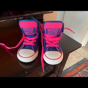 Pink and blue high top converse
